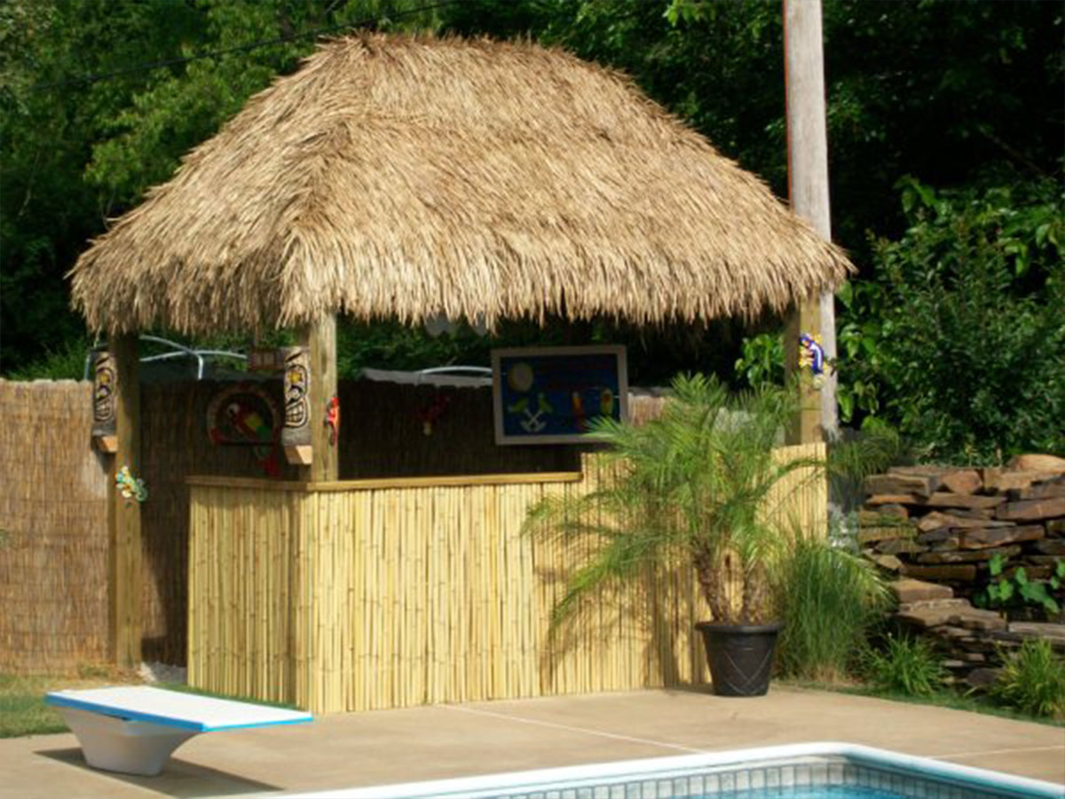 tiki bar with mexican palm thatch and rolled bamboo fencing